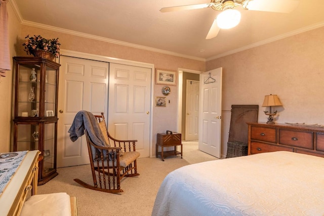 bedroom with light carpet, a closet, a ceiling fan, and crown molding