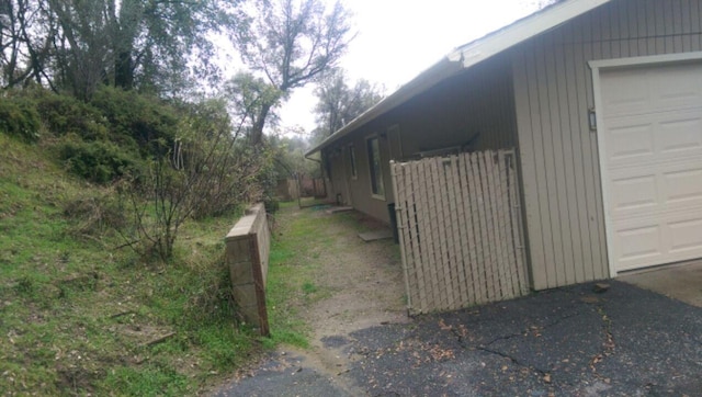 view of side of property with a garage