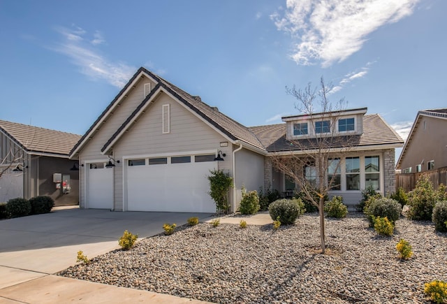 view of front of home featuring driveway and an attached garage