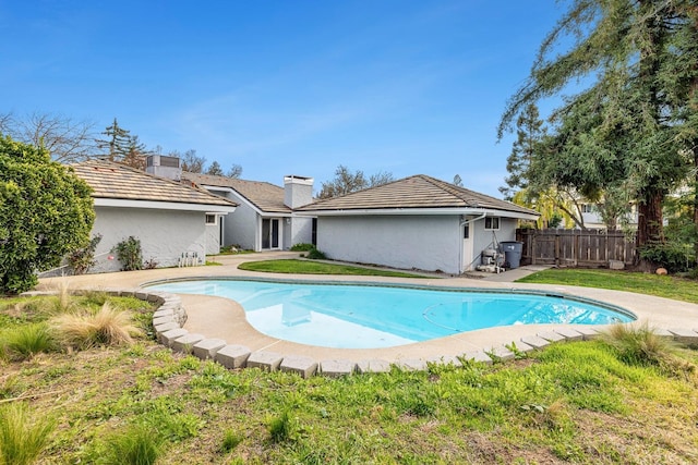 view of swimming pool featuring a fenced in pool, fence, and central AC unit