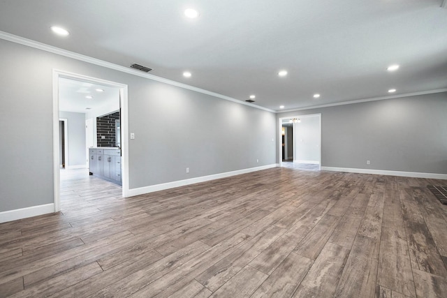 unfurnished room featuring recessed lighting, baseboards, and wood finished floors