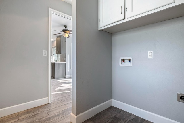 laundry area with cabinet space, washer hookup, dark wood finished floors, and hookup for an electric dryer