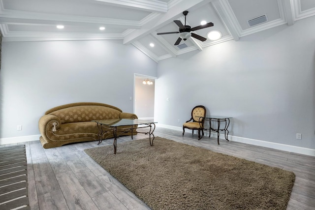 sitting room with vaulted ceiling with beams, visible vents, ceiling fan, wood finished floors, and baseboards