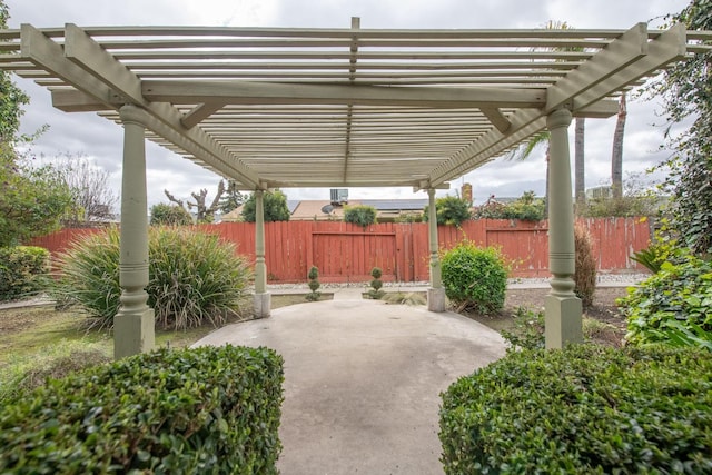 view of patio with fence and a pergola