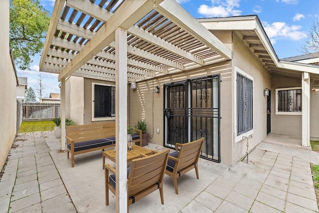 view of patio with fence and a pergola