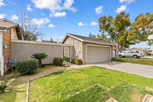 exterior space featuring concrete driveway and a lawn