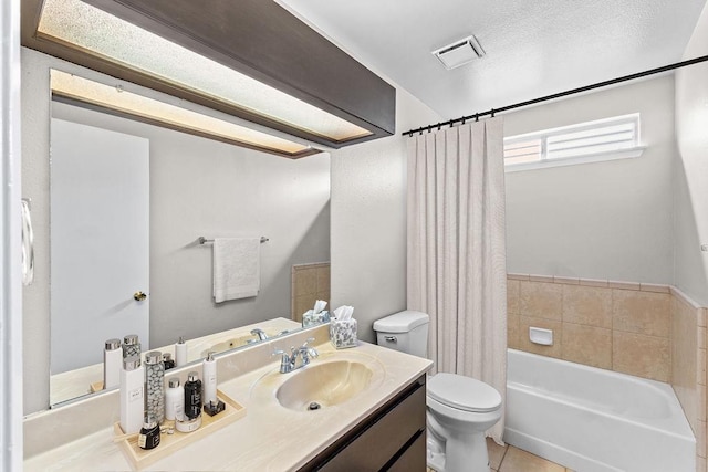 full bathroom with toilet, shower / tub combo, vanity, visible vents, and tile patterned floors