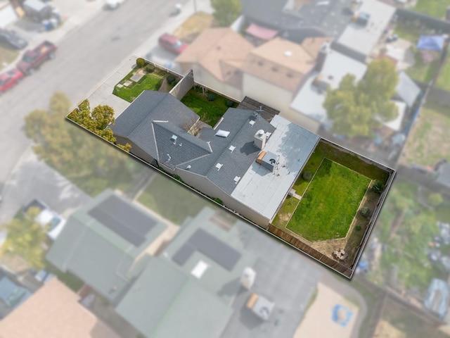 birds eye view of property with a residential view