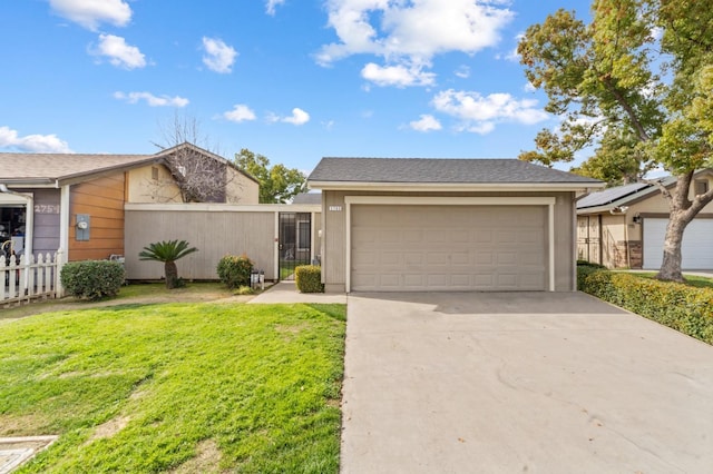 view of front of property with a garage, driveway, a front lawn, and fence