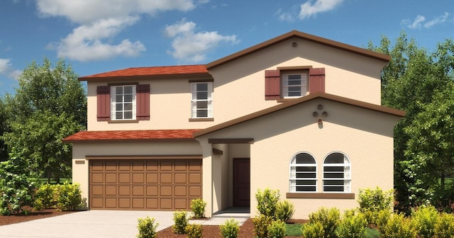 view of front of home with driveway, an attached garage, and stucco siding