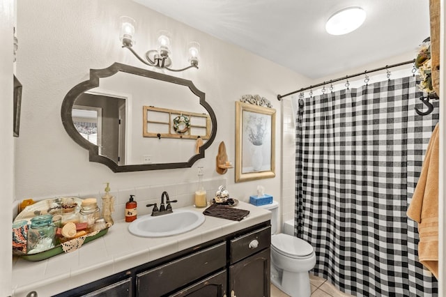 bathroom featuring tile patterned flooring, toilet, vanity, tasteful backsplash, and shower / bath combination with curtain