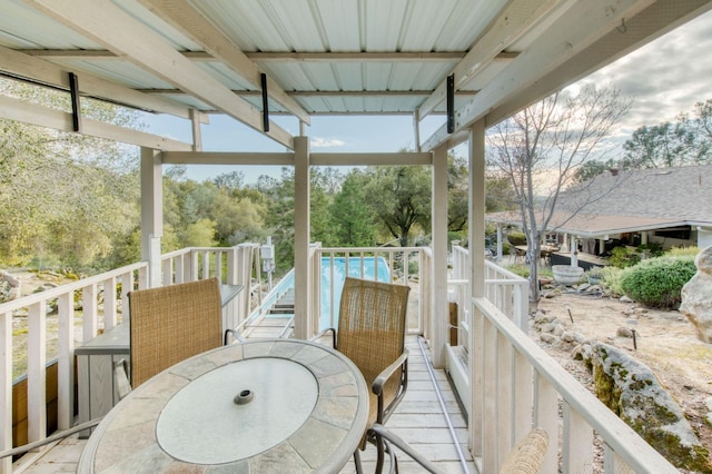 wooden terrace with outdoor dining area