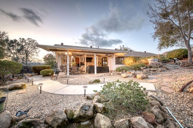 back of property featuring a patio area, fence, and ceiling fan