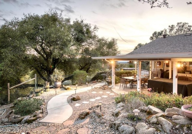 view of yard featuring a patio area and a fenced backyard