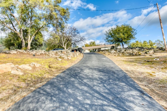 view of road featuring aphalt driveway