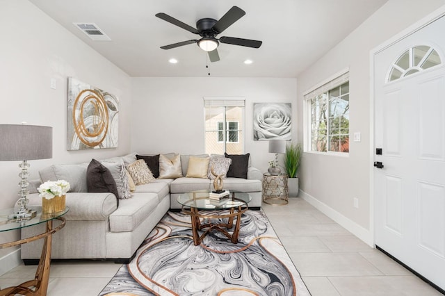 living area with light tile patterned floors, baseboards, visible vents, ceiling fan, and recessed lighting