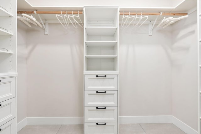 walk in closet featuring light tile patterned floors