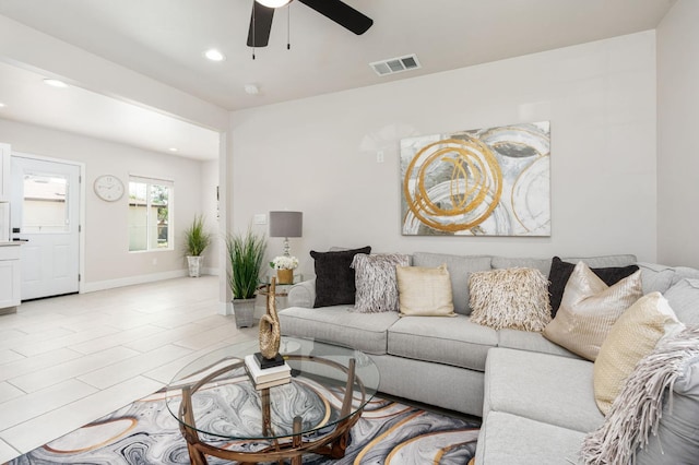 living area featuring baseboards, visible vents, a ceiling fan, and recessed lighting