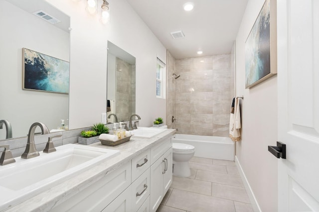 bathroom with visible vents, a sink, and tile patterned floors