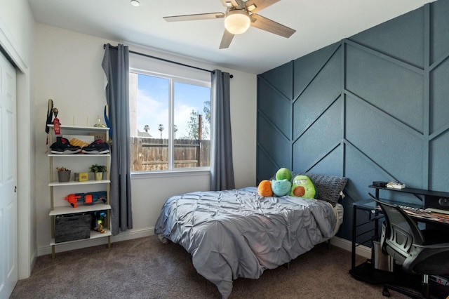 bedroom with carpet floors, ceiling fan, and baseboards