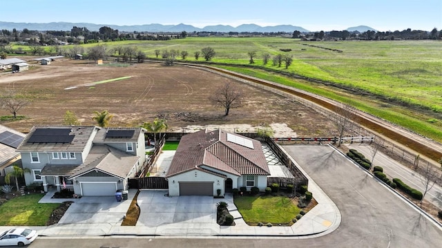 aerial view featuring a rural view and a mountain view