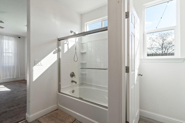 full bathroom featuring  shower combination and baseboards