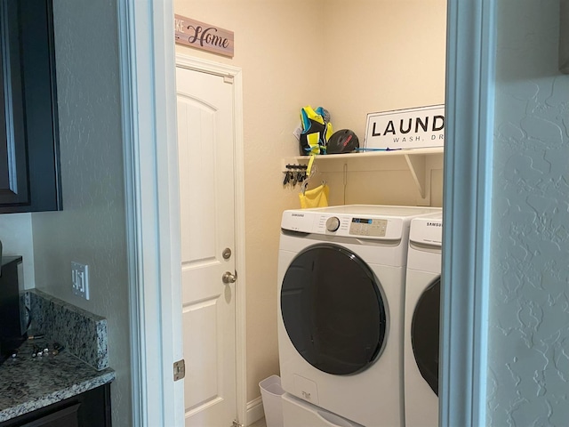 laundry area with laundry area and separate washer and dryer