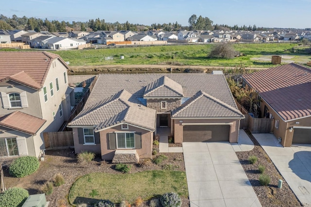 birds eye view of property with a residential view