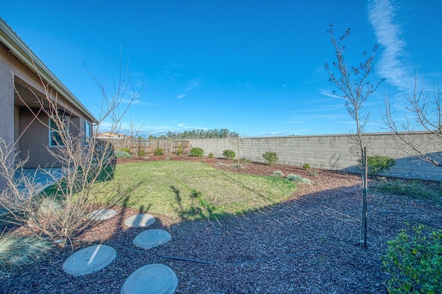 view of yard with a fenced backyard