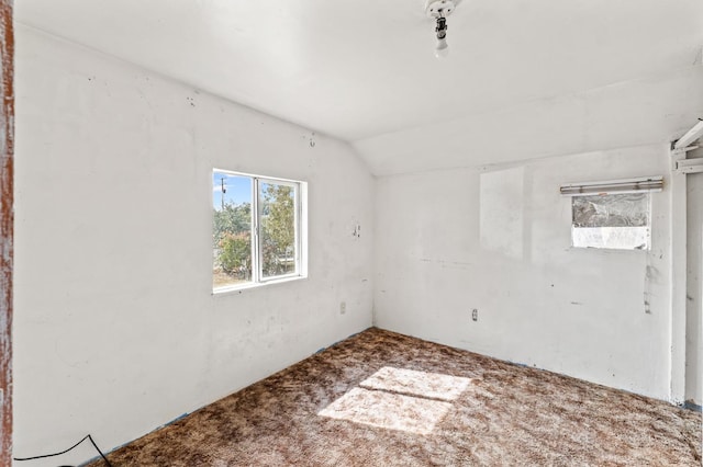 empty room with vaulted ceiling