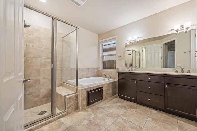 bathroom with double vanity, visible vents, a sink, a shower stall, and a bath