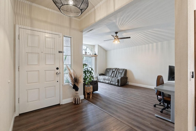 foyer entrance with dark wood-style floors, baseboards, and vaulted ceiling