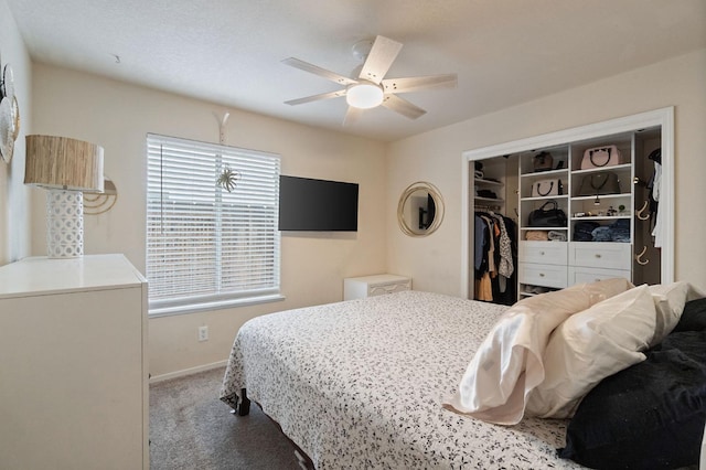 carpeted bedroom featuring ceiling fan, a closet, and baseboards