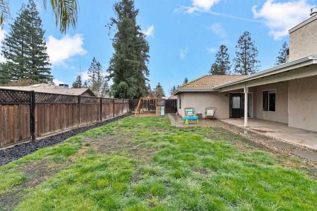 view of yard with a patio area and a fenced backyard