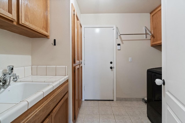 kitchen featuring light tile patterned floors and tile counters