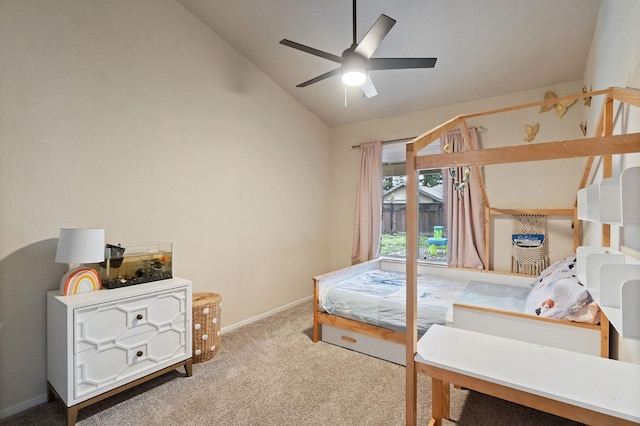 carpeted bedroom featuring lofted ceiling, ceiling fan, and baseboards