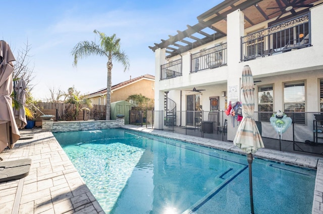 view of pool featuring a patio area, a fenced backyard, a ceiling fan, and a fenced in pool