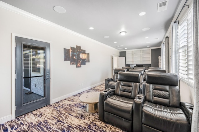 home theater with baseboards, recessed lighting, visible vents, and crown molding