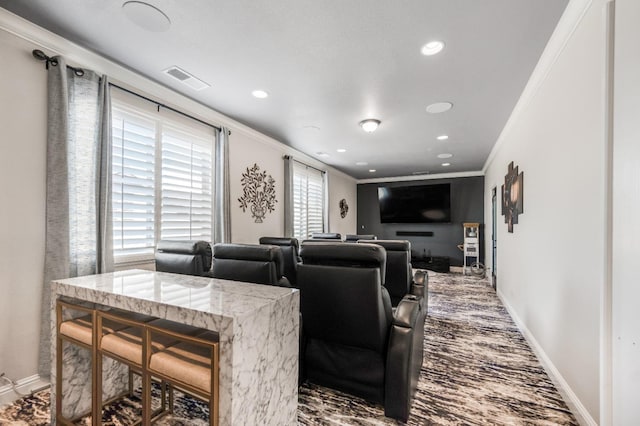 cinema room with baseboards, recessed lighting, visible vents, and crown molding