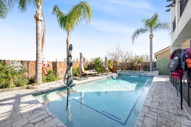 view of swimming pool with a fenced in pool, a patio area, and a fenced backyard