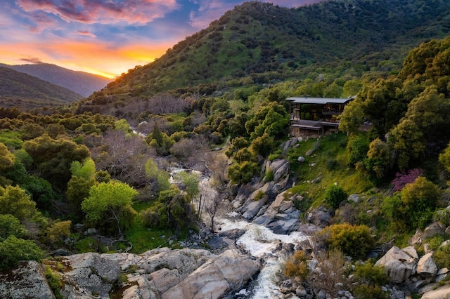 property view of mountains featuring a wooded view