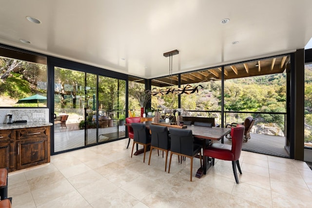 sunroom / solarium featuring a wealth of natural light