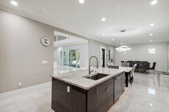 kitchen featuring dark brown cabinetry, crown molding, a sink, baseboards, and pendant lighting