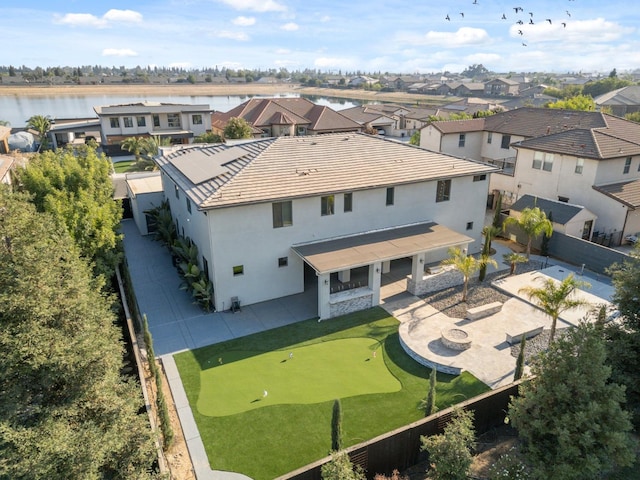 drone / aerial view with a water view and a residential view