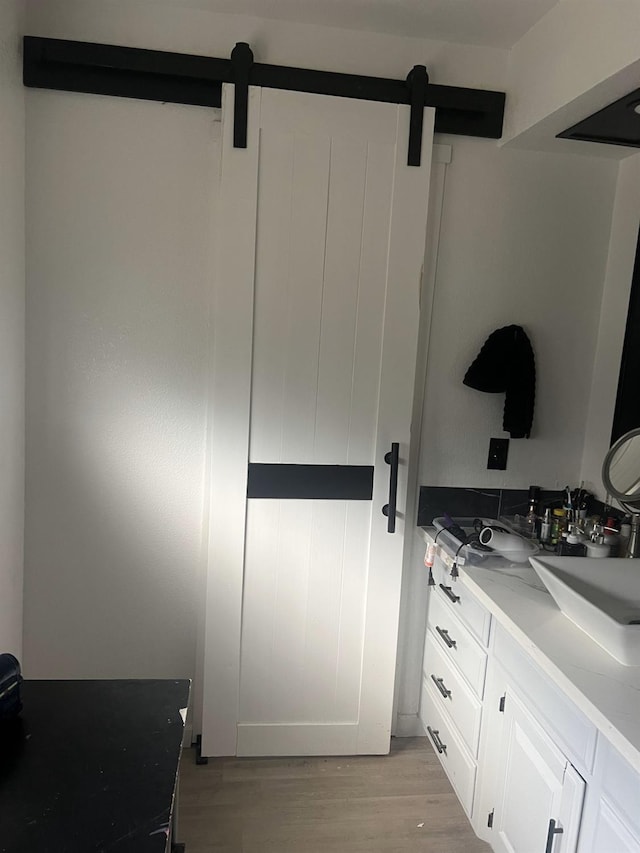 15245 El Mar Ln, Kerman, CA 93630 - bathroom featuring a sink and wood finished floors