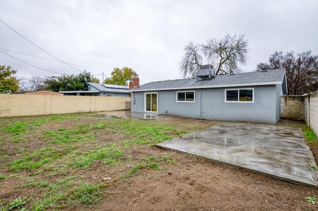 back of house featuring a patio, stucco siding, a fenced backyard, and central air condition unit