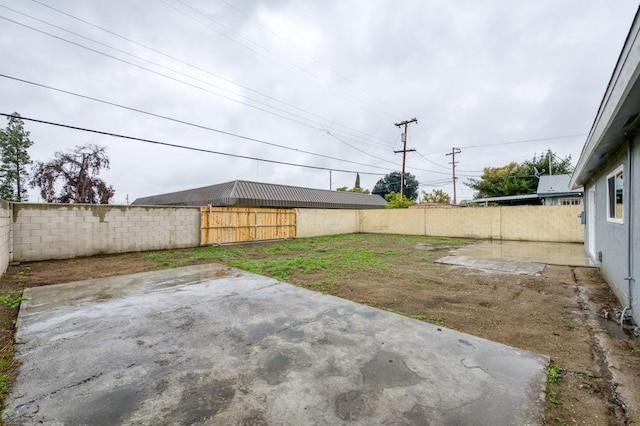 view of yard featuring a patio area and a fenced backyard