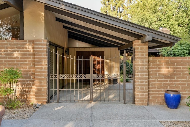 view of gate with fence