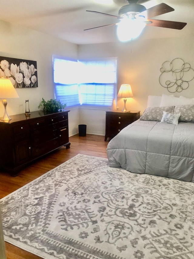 bedroom featuring wood finished floors and a ceiling fan