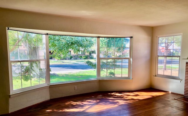 unfurnished sunroom featuring plenty of natural light